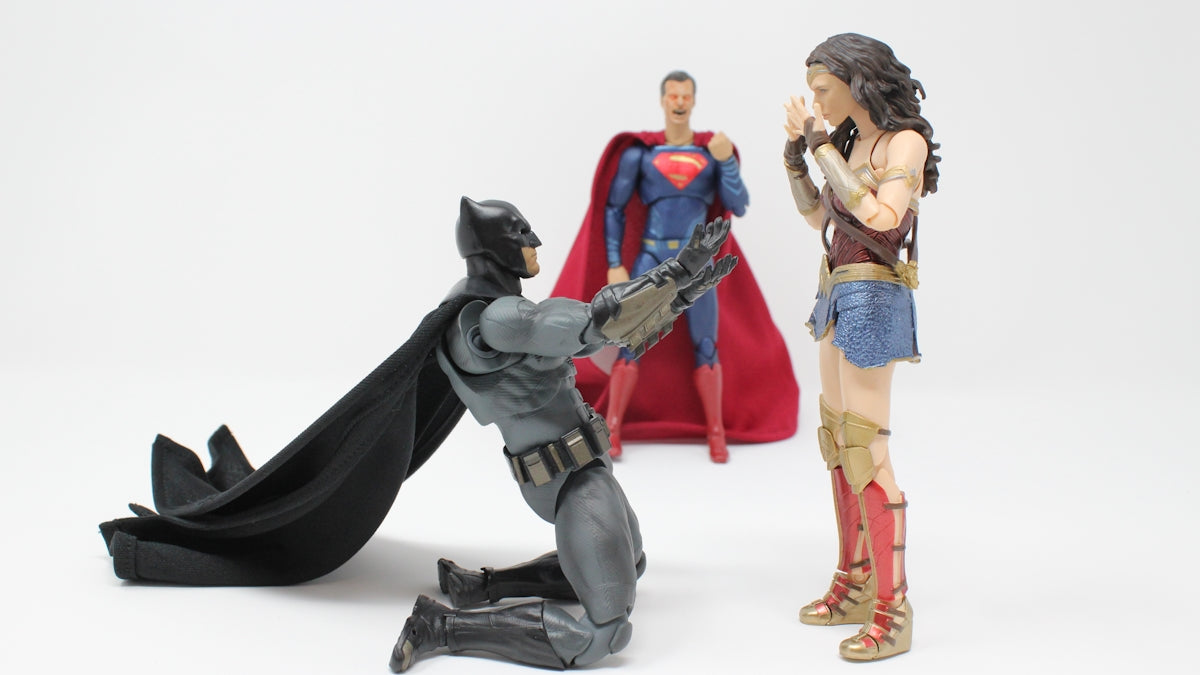 Superman, Batman, and Wonder Woman action figures