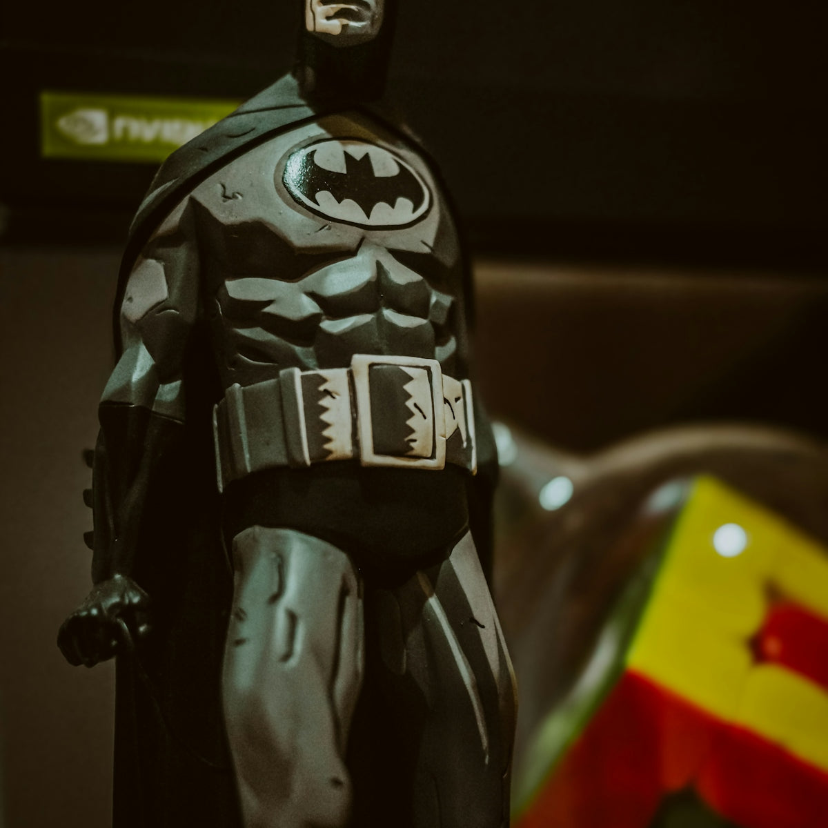 a toy batman standing on top of a table