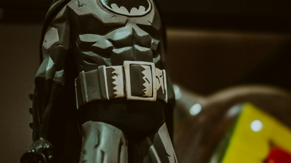 a toy batman standing on top of a table
