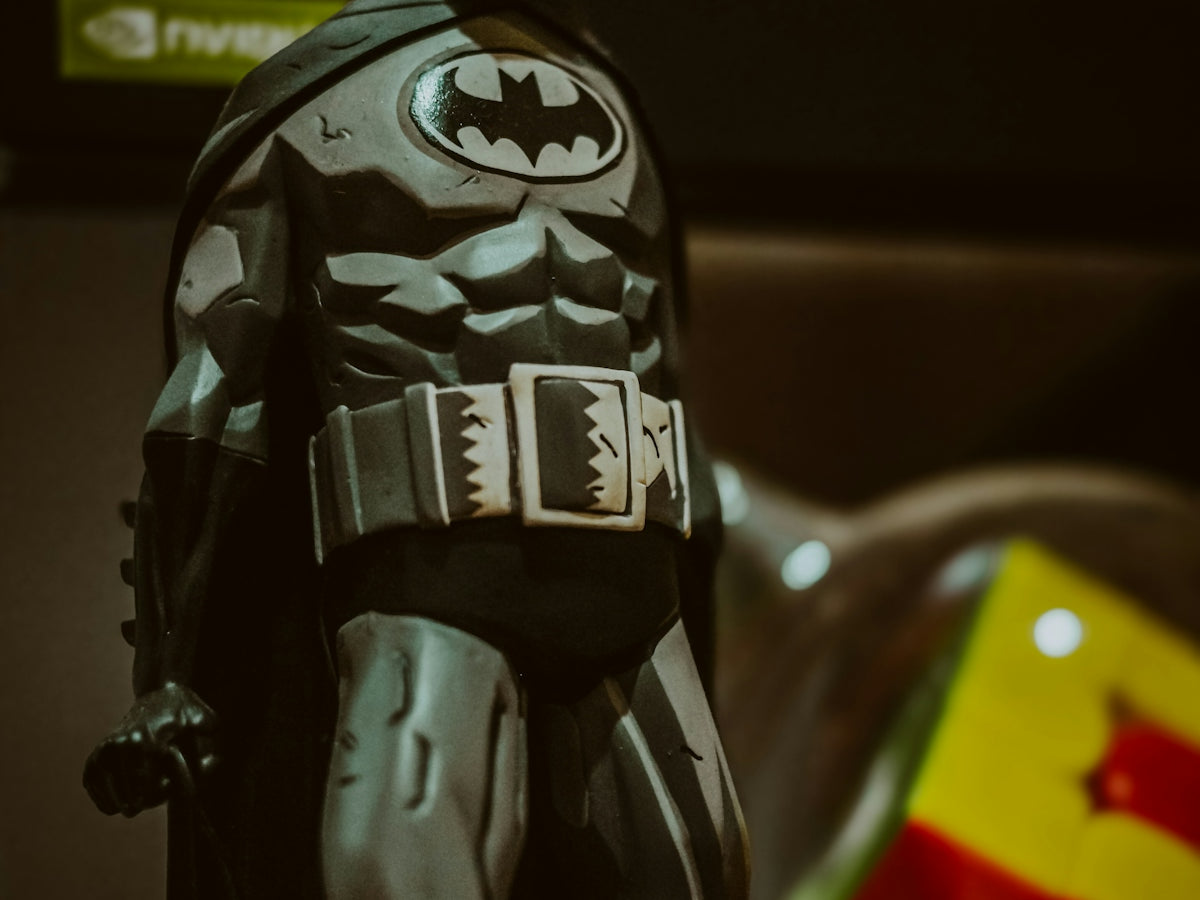 a toy batman standing on top of a table