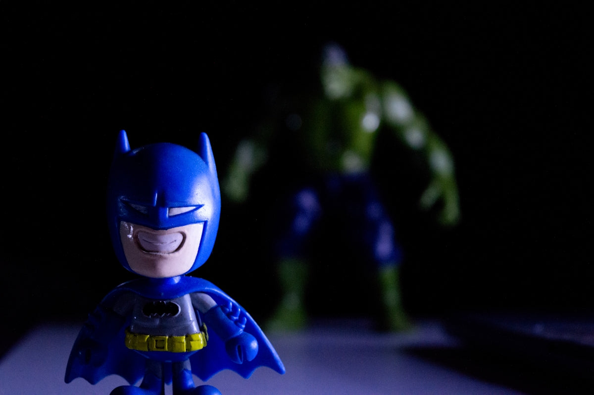 Batman toy in foreground, hulk toy in background
