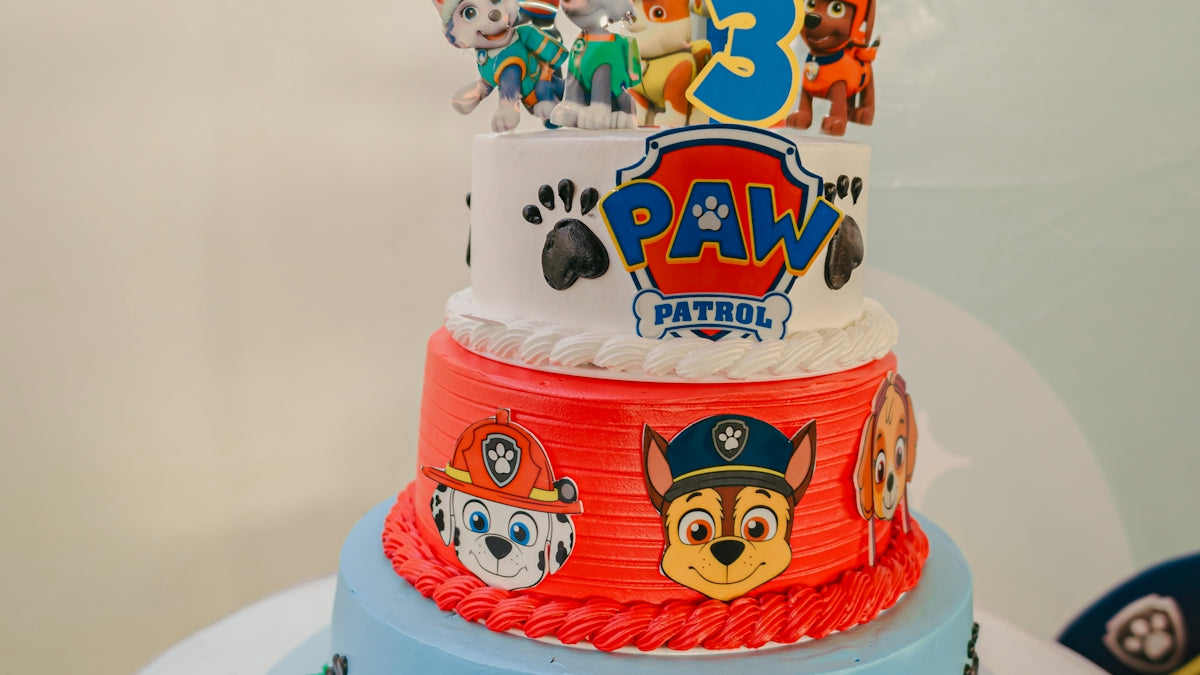 Paw patrol themed birthday cake with three tiers.